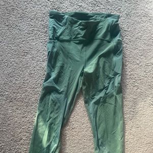 Green Cropped Lululemon Leggings with decorative breathable fabric